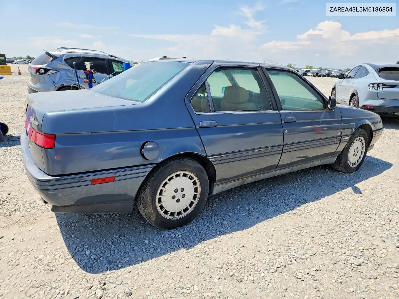 1991 Alfa Romeo 164 L VIN: ZAREA43L5M6186854 Lot: 61565366