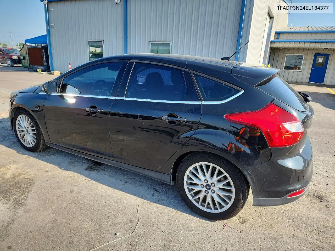 2014 Ford Focus Titanium VIN: 1FADP3N24EL184377 Lot: 62075526