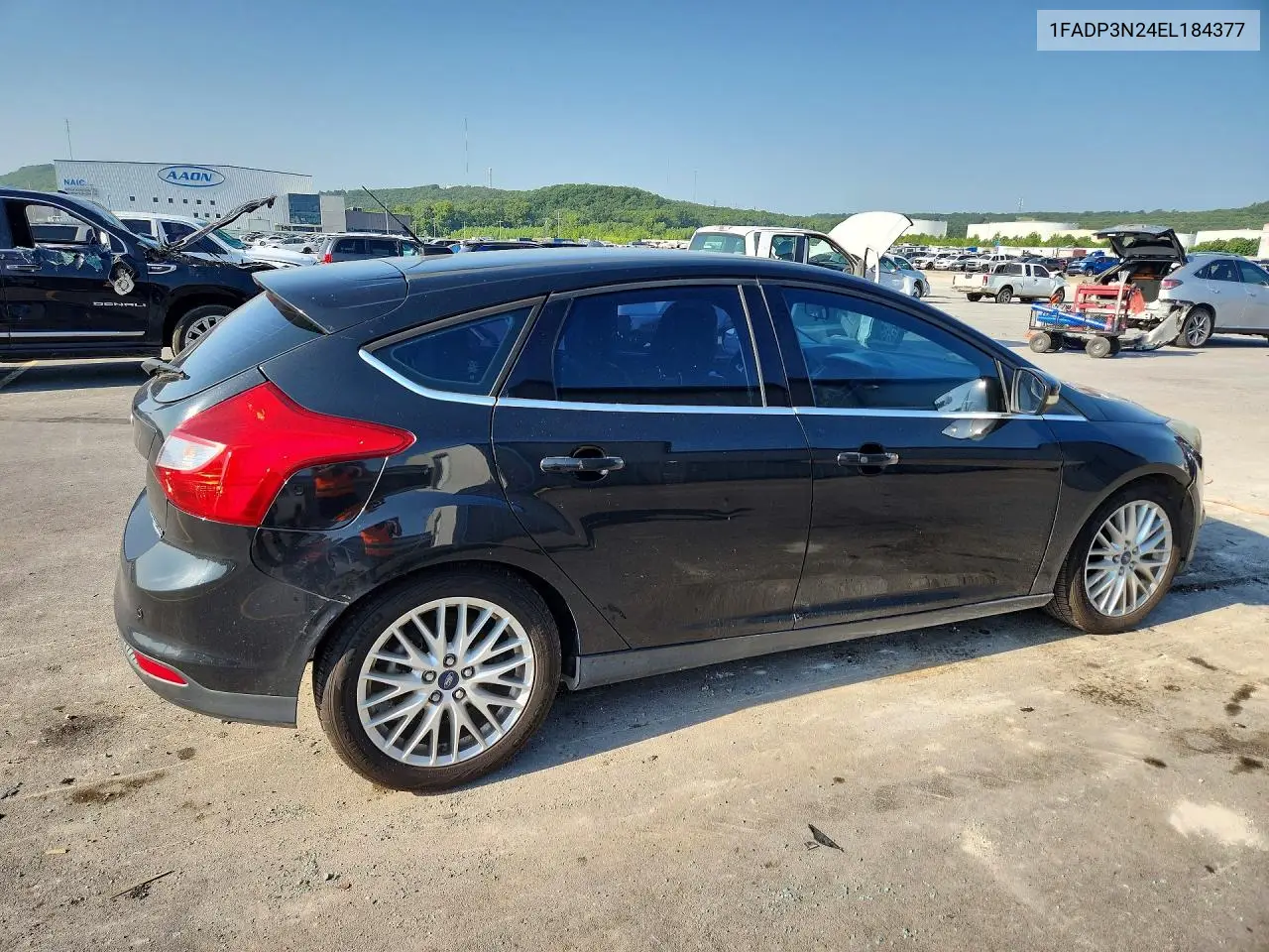 2014 Ford Focus Titanium VIN: 1FADP3N24EL184377 Lot: 62075526