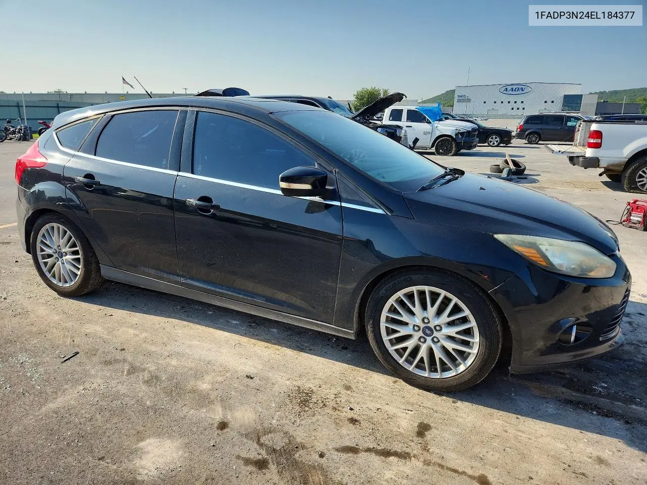 2014 Ford Focus Titanium VIN: 1FADP3N24EL184377 Lot: 62075526
