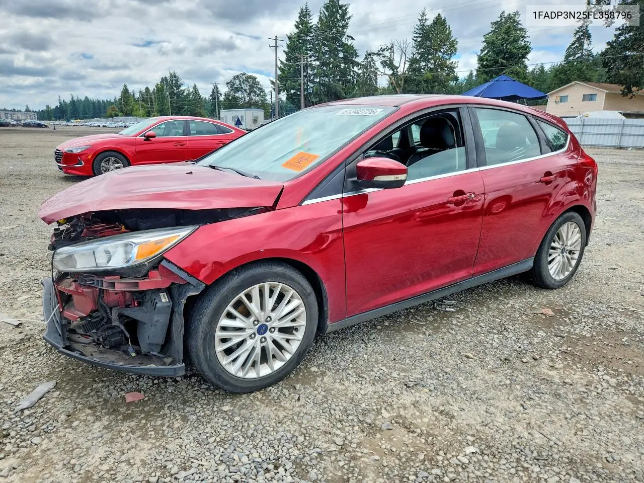 2015 Ford Focus Titanium VIN: 1FADP3N25FL358796 Lot: 61342726