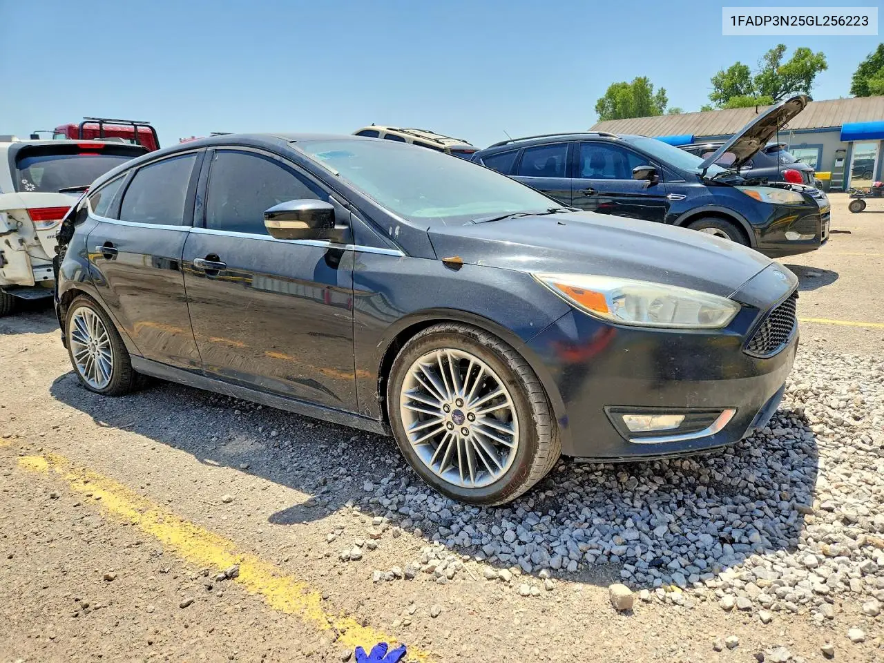 2016 Ford Focus Titanium VIN: 1FADP3N25GL256223 Lot: 61688476
