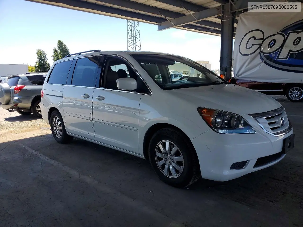 2009 Honda Odyssey Exl VIN: 5FNRL38709B000595 Lot: 58929286