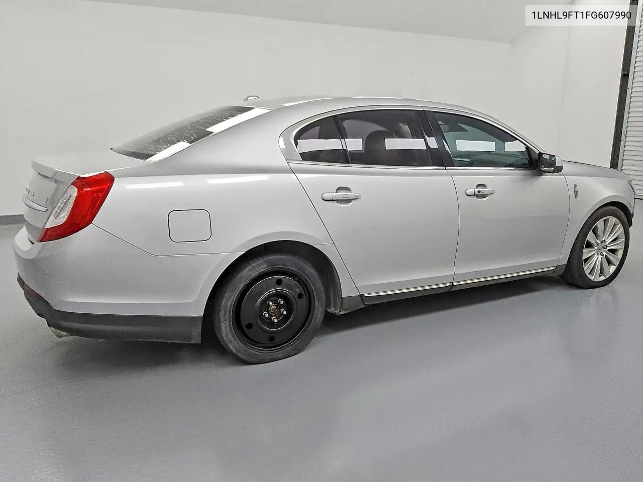 2015 Lincoln Mks VIN: 1LNHL9FT1FG607990 Lot: 51817836