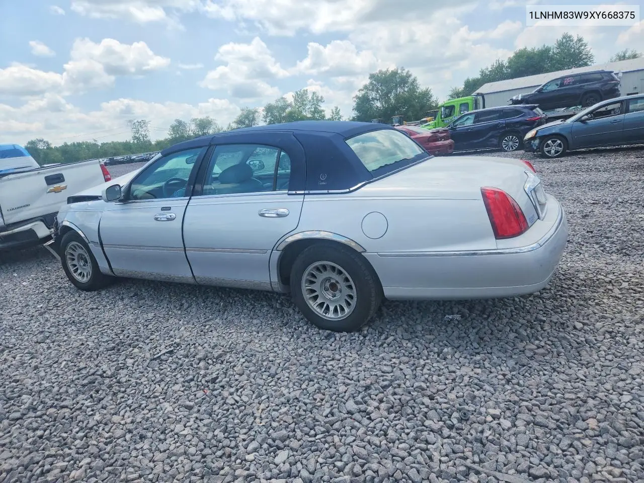 1999 Lincoln Town Car Cartier VIN: 1LNHM83W9XY668375 Lot: 60270636