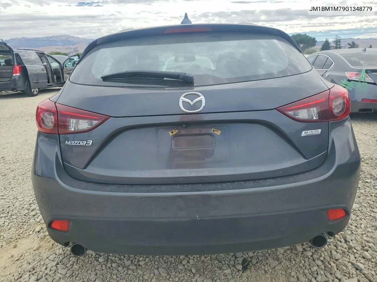 2016 Mazda 3 Touring VIN: JM1BM1M79G1348779 Lot: 61735216