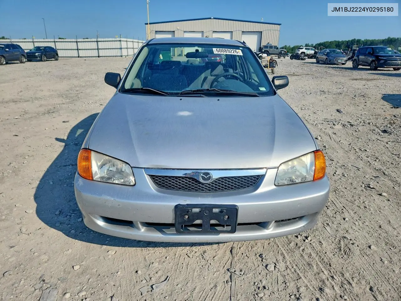 2000 Mazda Protege Dx VIN: JM1BJ2224Y0295180 Lot: 60089226