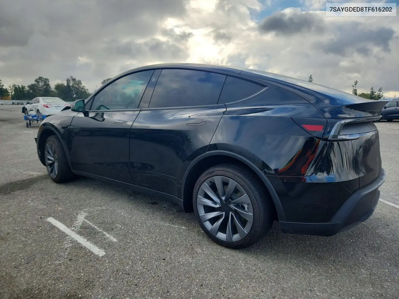 2026 Tesla Model Y VIN: 7SAYGDED8TF616202 Lot: 55449786
