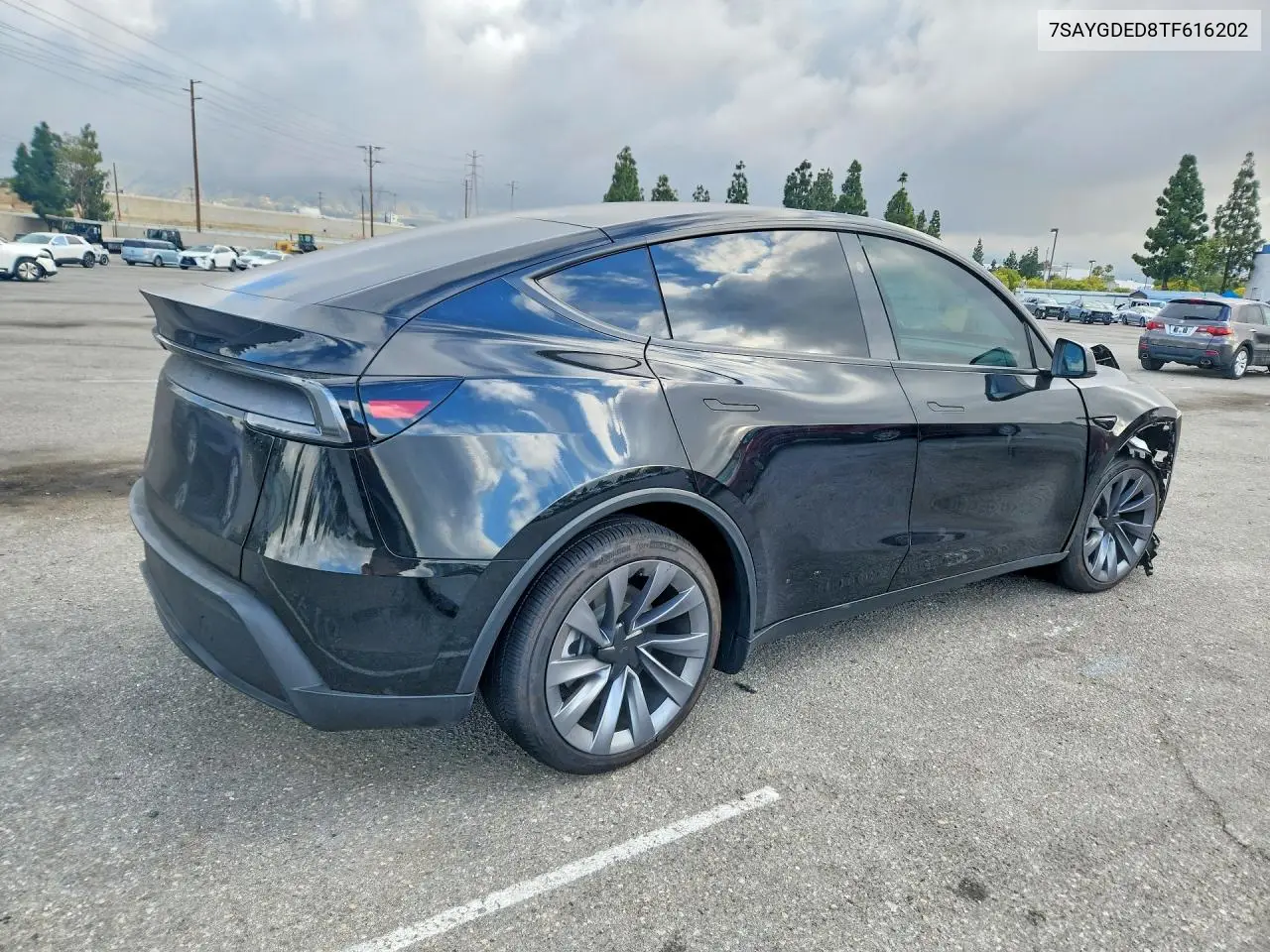 2026 Tesla Model Y VIN: 7SAYGDED8TF616202 Lot: 55449786