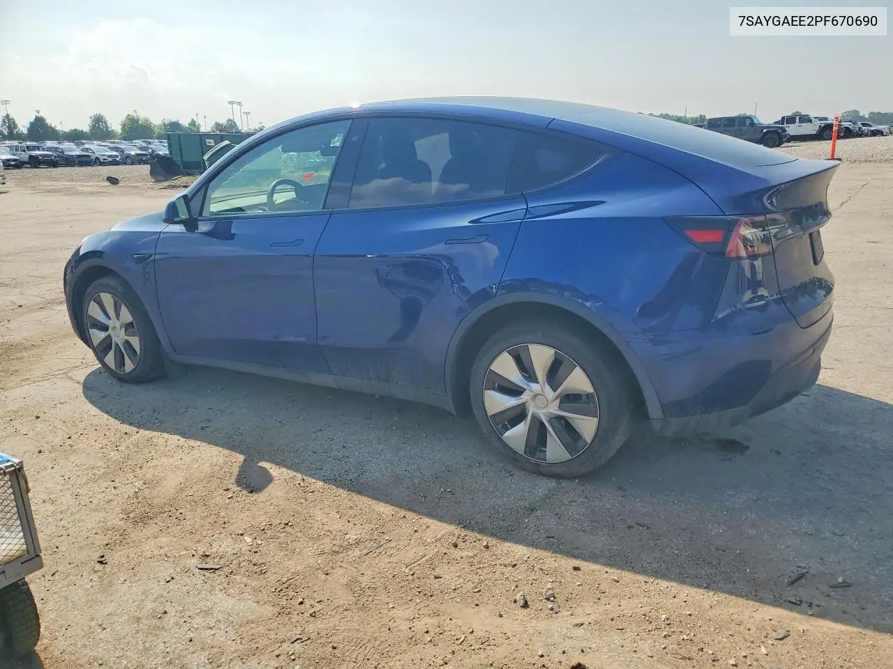 2023 Tesla Model Y VIN: 7SAYGAEE2PF670690 Lot: 61866856