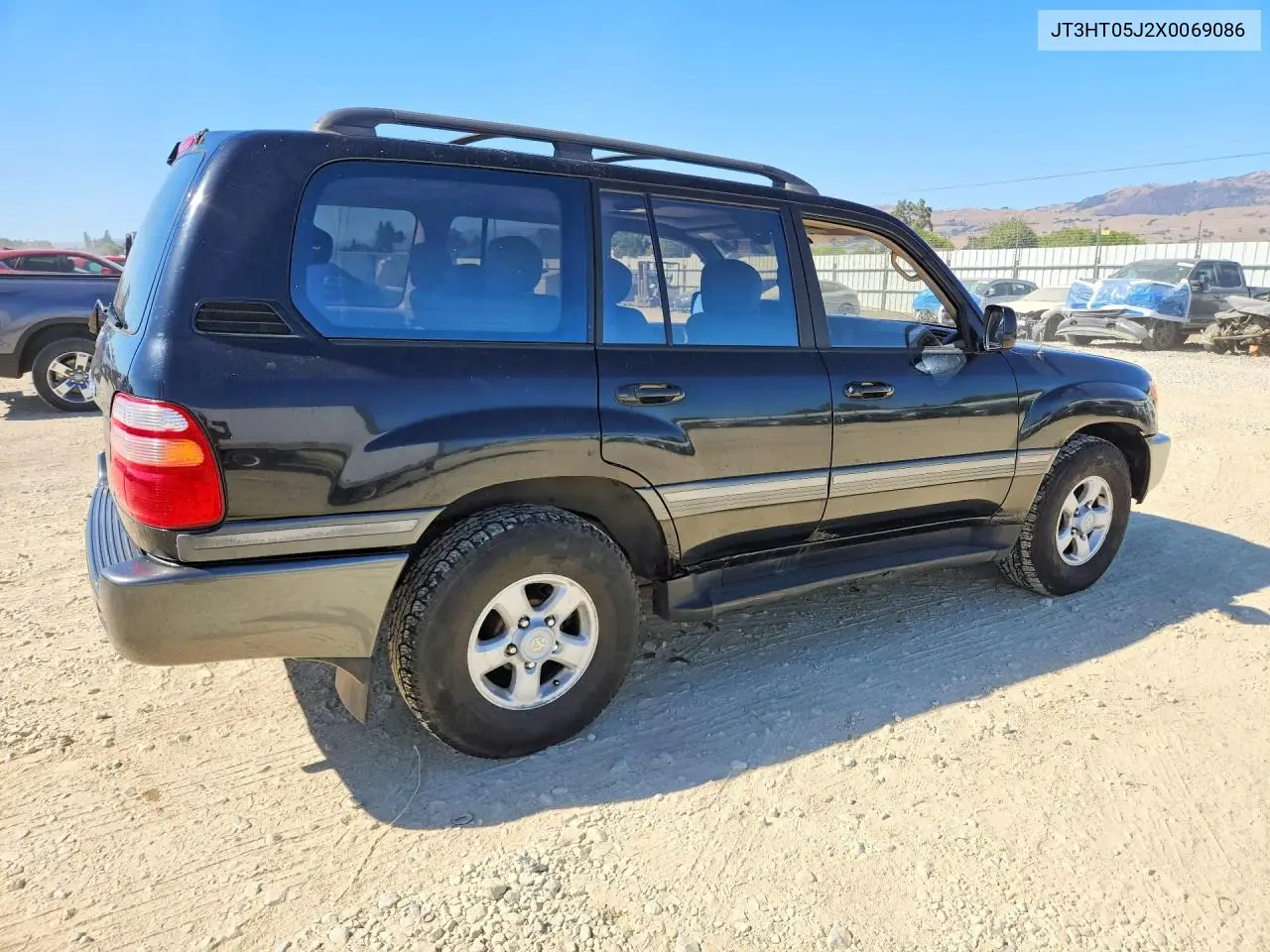 1999 Toyota Land Cruiser Base VIN: JT3HT05J2X0069086 Lot: 59403426