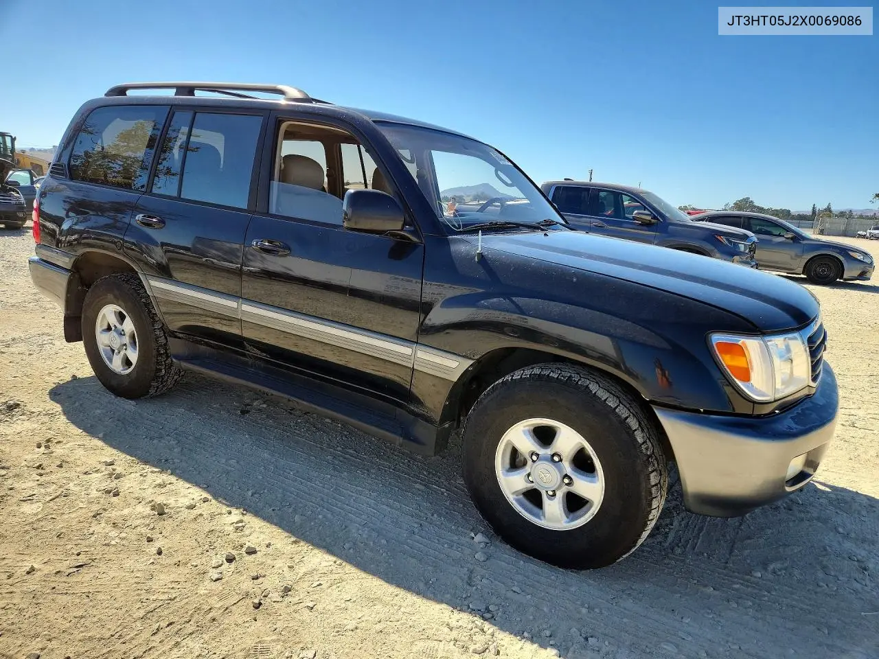 1999 Toyota Land Cruiser Base VIN: JT3HT05J2X0069086 Lot: 59403426