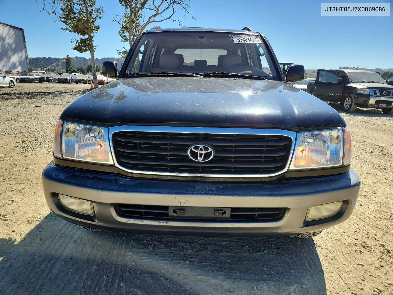 1999 Toyota Land Cruiser Base VIN: JT3HT05J2X0069086 Lot: 59403426