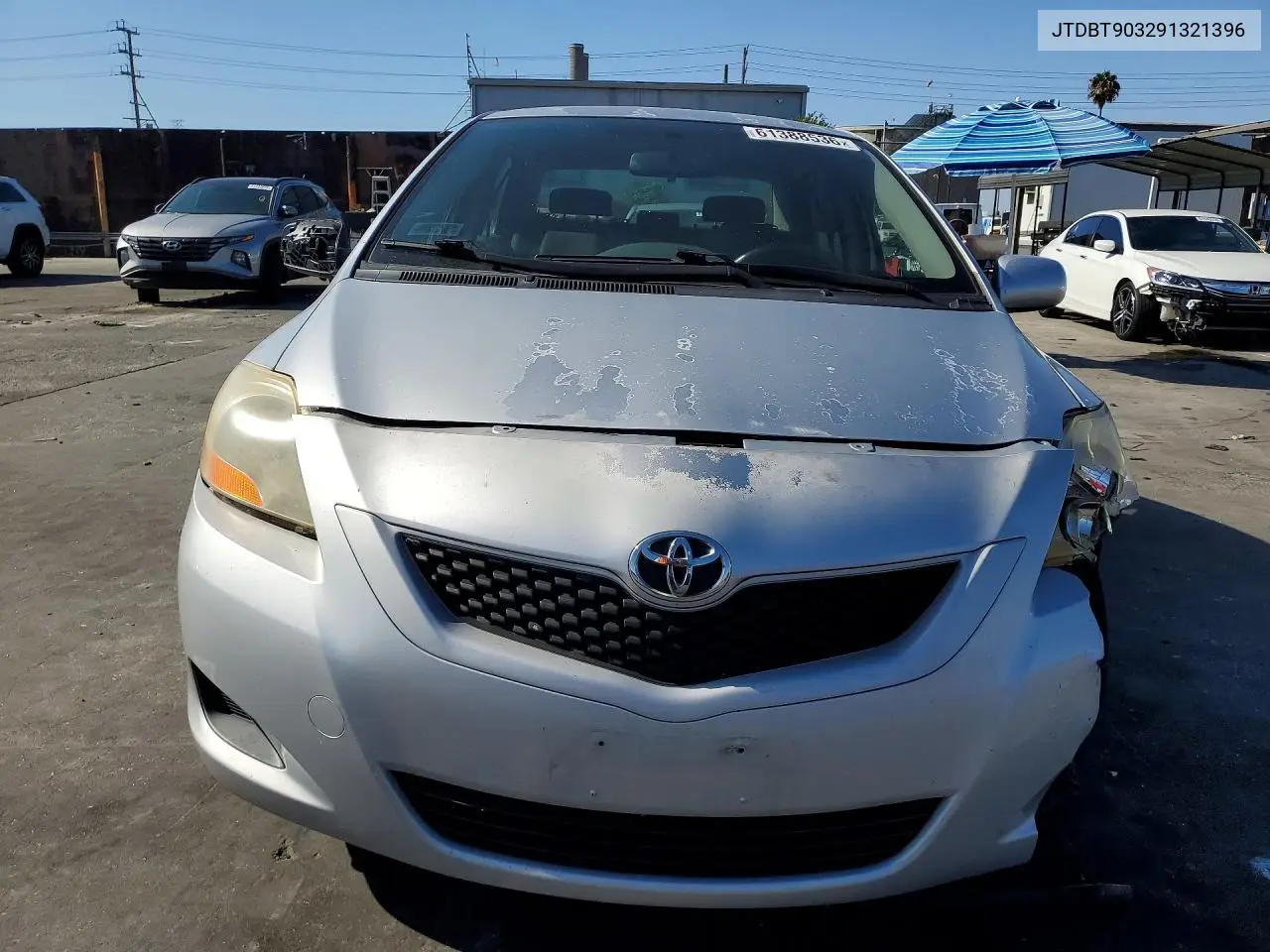 2009 Toyota Yaris Base VIN: JTDBT903291321396 Lot: 61388536